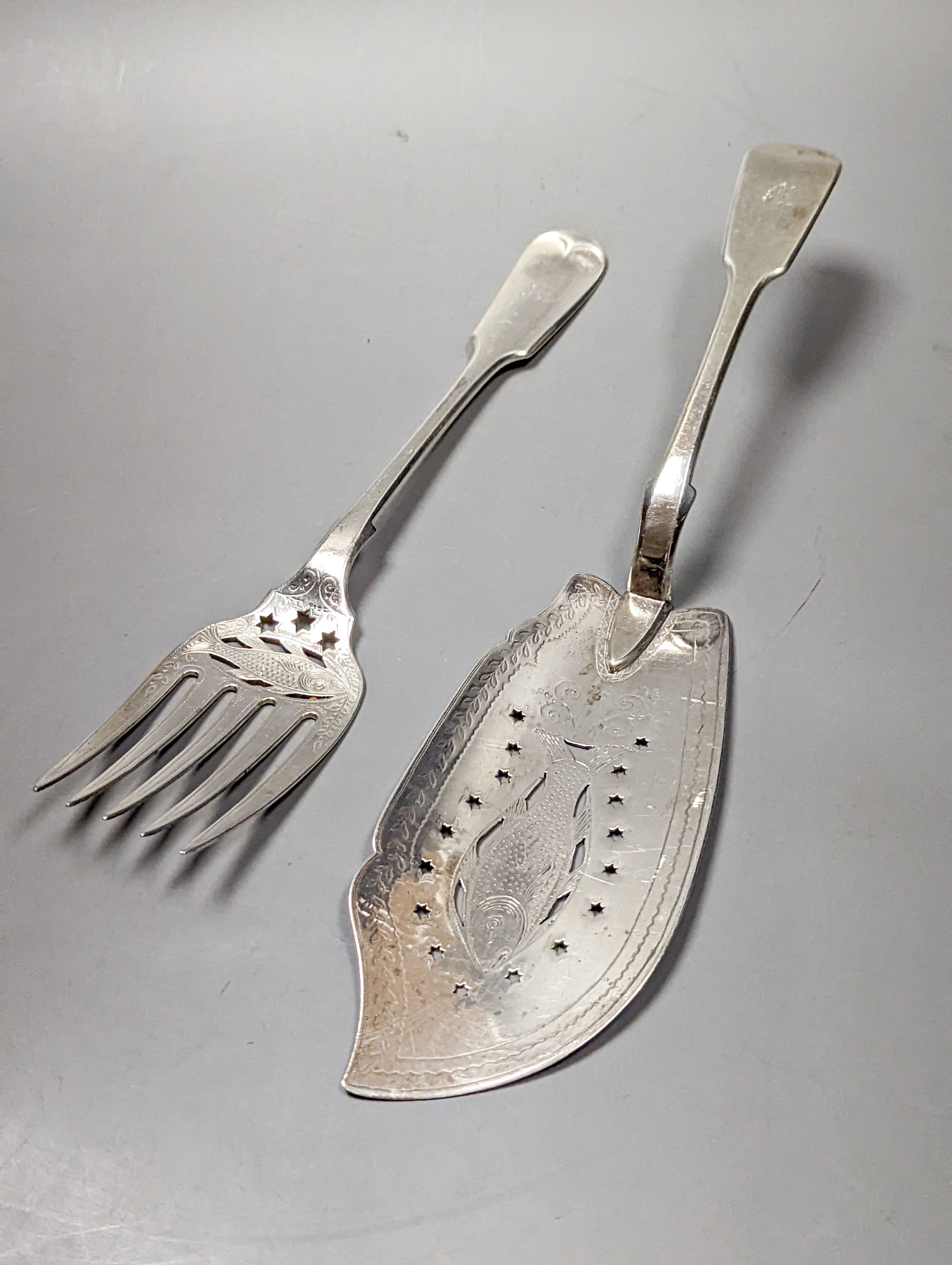 A matched pair of Victorian silver fish servers, Martin, Hall & Co, Sheffield, 1868 and Lawrence Aitchison, Glasgow, 1840, 9oz.